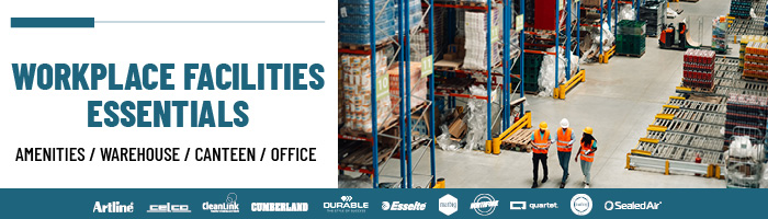 Three people walking in a warehouse